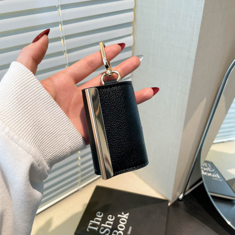 Detachable black storage pouch with gold-tone clip